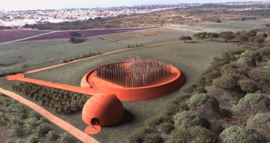 aerial view of red clay memorial on green landscape