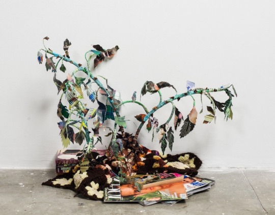 a tree created from different collage leaves of queer ephemera