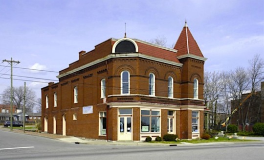 building of a traditional dark red brick building in North Nashville